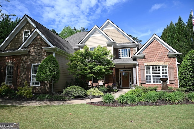 24 Douglas Dr, Jefferson, GA 30549 - craftsman-style home with brick siding and a front lawn