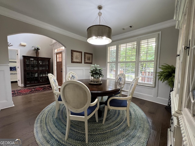 24 Douglas Dr, Jefferson, GA 30549 - dining room with arched walkways, ornamental molding, a decorative wall, plenty of natural light, and dark wood-style flooring