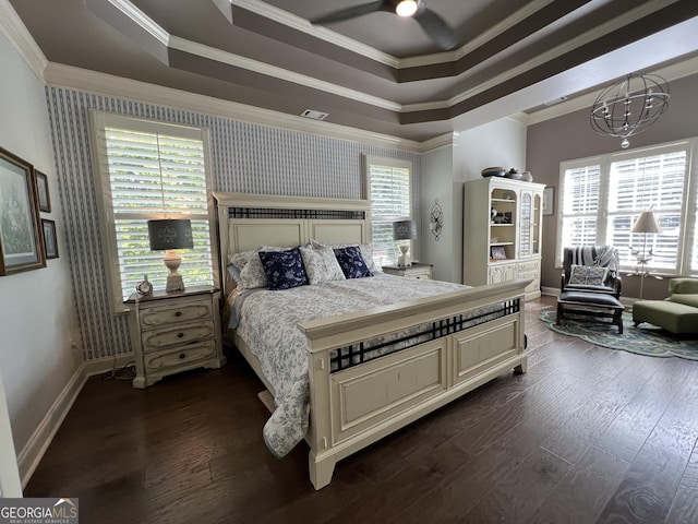 24 Douglas Dr, Jefferson, GA 30549 - bedroom with crown molding, a tray ceiling, baseboards, dark wood-style flooring, and wallpapered walls