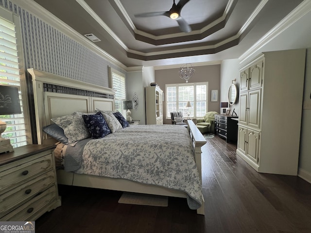 24 Douglas Dr, Jefferson, GA 30549 - bedroom featuring dark wood-type flooring, a raised ceiling, a ceiling fan, crown molding, and a chandelier