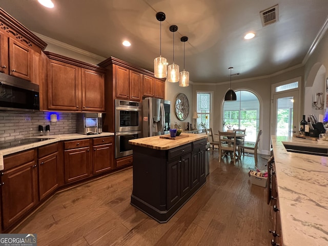 24 Douglas Dr, Jefferson, GA 30549 - kitchen with appliances with stainless steel finishes, ornamental molding, wooden counters, decorative backsplash, and recessed lighting