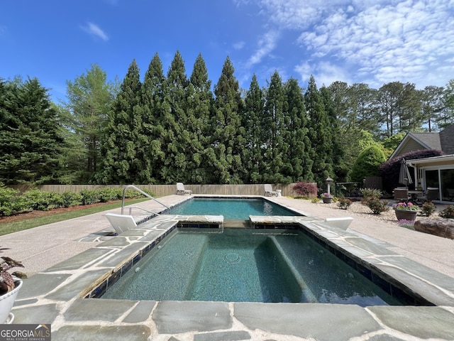 24 Douglas Dr, Jefferson, GA 30549 - view of pool featuring a pool with connected hot tub, a fenced backyard, and a patio area