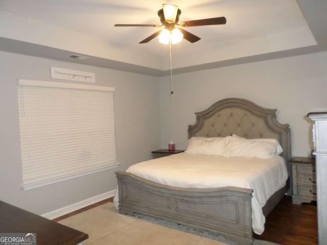 124 Fontenot Dr, Savannah, GA 31405 - bedroom with a tray ceiling, ceiling fan, and baseboards