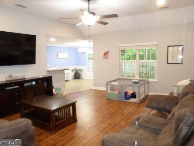 124 Fontenot Dr, Savannah, GA 31405 - living room featuring wood finished floors, a ceiling fan, lofted ceiling, baseboards, and a chandelier