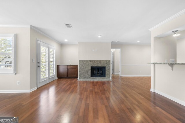 1538 Chantilly Dr NE Unit 224, Atlanta, GA 30324 - unfurnished living room featuring crown molding, baseboards, dark wood-style flooring, a premium fireplace, and recessed lighting