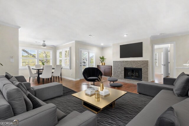 1538 Chantilly Dr NE Unit 224, Atlanta, GA 30324 - unfurnished living room with dark wood-style floors, a fireplace, baseboards, crown molding, and recessed lighting