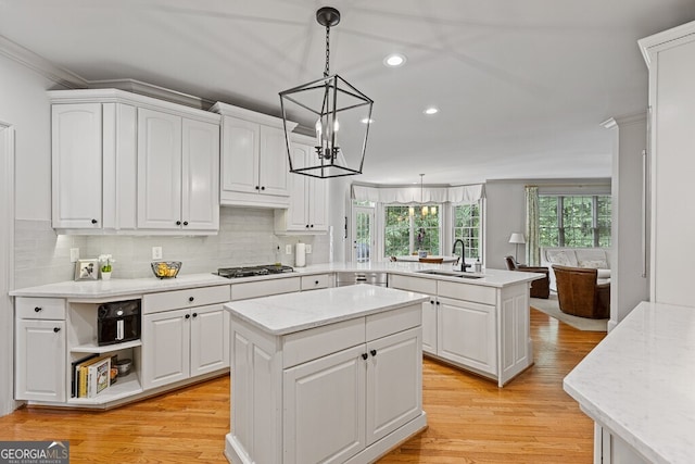 2332 Autumn Maple Dr, Braselton, GA 30517 - kitchen featuring a sink, a peninsula, recessed lighting, white cabinetry, and ornamental molding