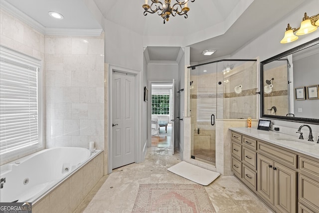 2332 Autumn Maple Dr, Braselton, GA 30517 - bathroom featuring a chandelier, a shower stall, vanity, a whirlpool tub, and crown molding