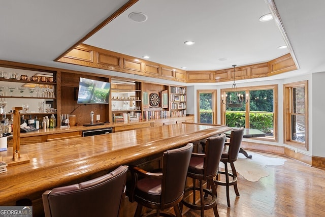 2332 Autumn Maple Dr, Braselton, GA 30517 - indoor bar with pendant lighting, light wood-style flooring, recessed lighting, and dishwasher