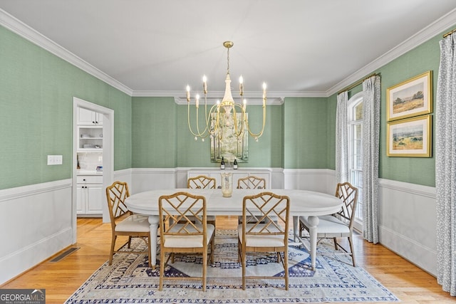 2332 Autumn Maple Dr, Braselton, GA 30517 - dining area featuring crown molding, light wood finished floors, wainscoting, a chandelier, and wallpapered walls