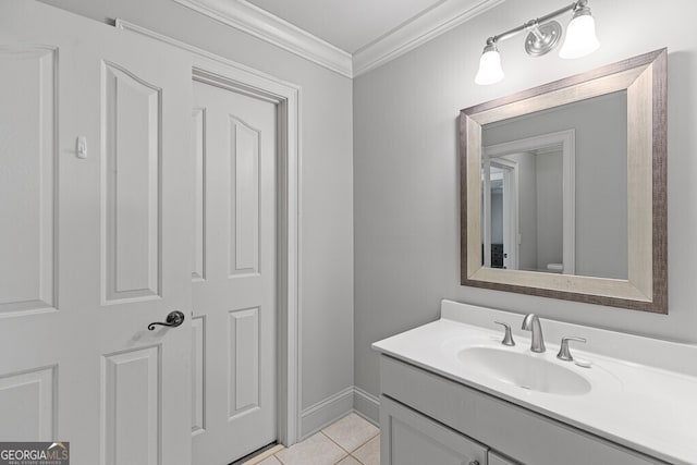 2332 Autumn Maple Dr, Braselton, GA 30517 - bathroom with tile patterned floors, crown molding, vanity, toilet, and baseboards