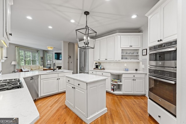 2332 Autumn Maple Dr, Braselton, GA 30517 - kitchen with open shelves, appliances with stainless steel finishes, a sink, a chandelier, and recessed lighting