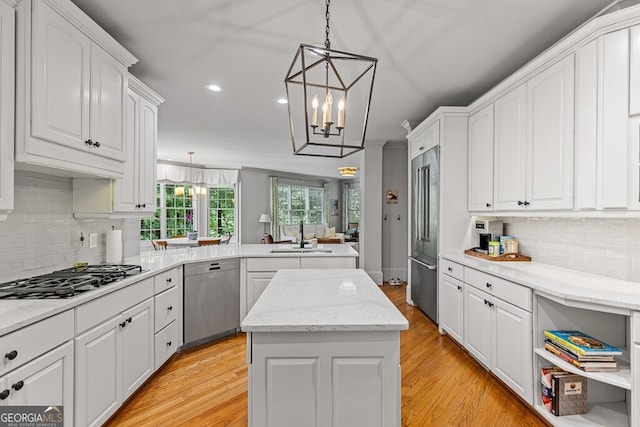 2332 Autumn Maple Dr, Braselton, GA 30517 - kitchen with appliances with stainless steel finishes, a peninsula, a sink, white cabinets, and recessed lighting