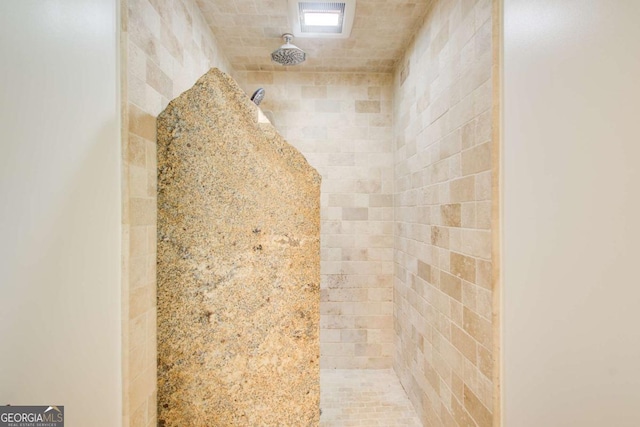 bathroom view of tiled shower