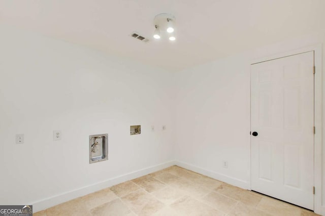 laundry room with washer hookup and baseboards