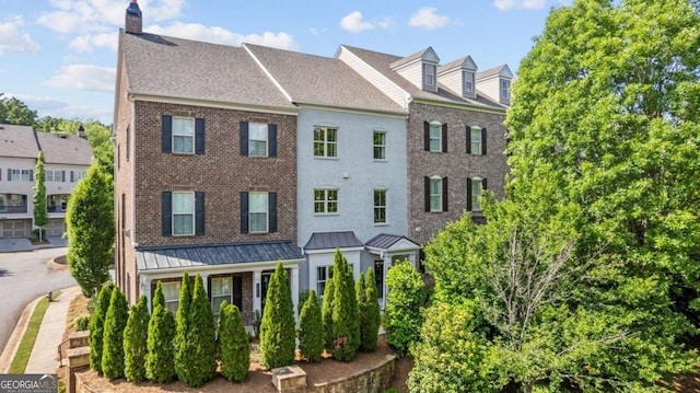 1914 Forte Ln, Alpharetta, GA 30009 - townhome / multi-family property with brick siding, a chimney, a shingled roof, and a standing seam roof