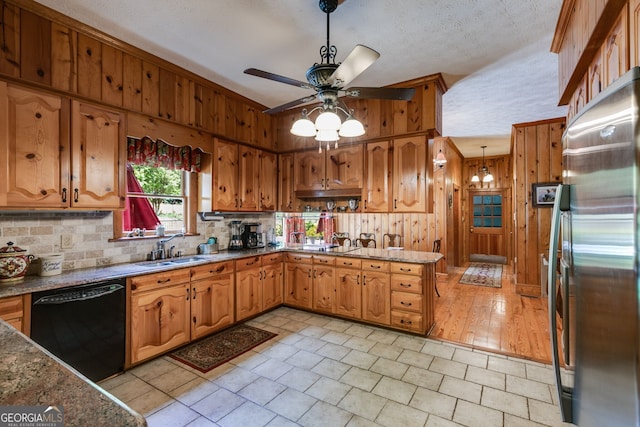 kitchen with dishwasher, freestanding refrigerator, a sink, a ceiling fan, and backsplash