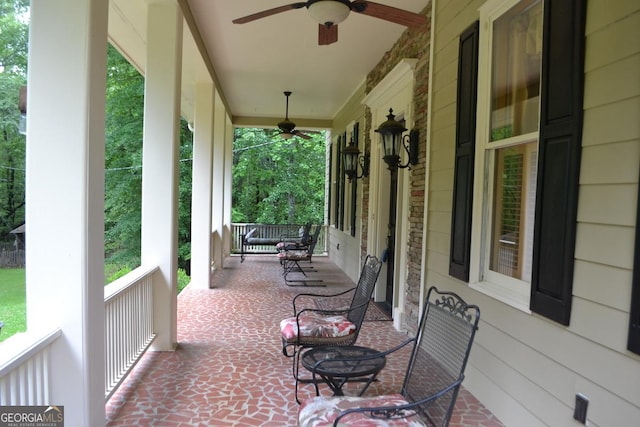 view of patio with a ceiling fan and a porch