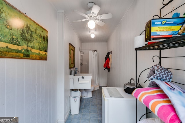 laundry room featuring tile patterned flooring and a ceiling fan