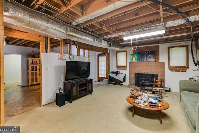living room featuring a brick fireplace