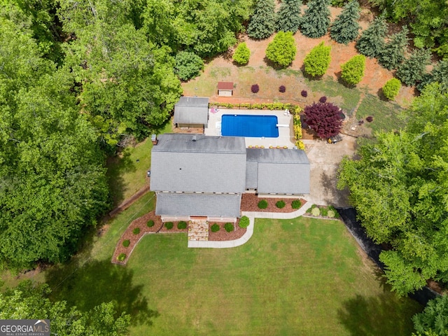 view of subject property with a pool