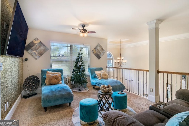sitting room with ceiling fan, carpet flooring, a chandelier, and crown molding