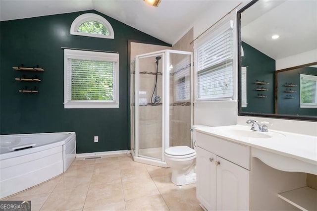 890 Oriole Ln, Marietta, GA 30067 - full bathroom featuring vaulted ceiling, a shower stall, vanity, toilet, and tile patterned flooring