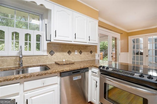 890 Oriole Ln, Marietta, GA 30067 - kitchen with appliances with stainless steel finishes, french doors, a sink, light stone countertops, and white cabinets