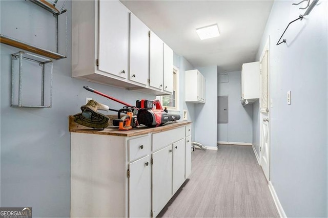 890 Oriole Ln, Marietta, GA 30067 - kitchen with white cabinets, light wood finished floors, baseboards, and light countertops