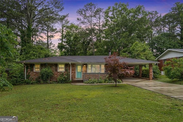 890 Oriole Ln, Marietta, GA 30067 - ranch-style home with concrete driveway, a front lawn, brick siding, and an attached carport