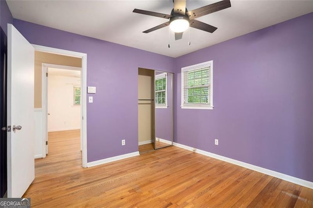 890 Oriole Ln, Marietta, GA 30067 - unfurnished bedroom featuring light wood finished floors, baseboards, and a closet