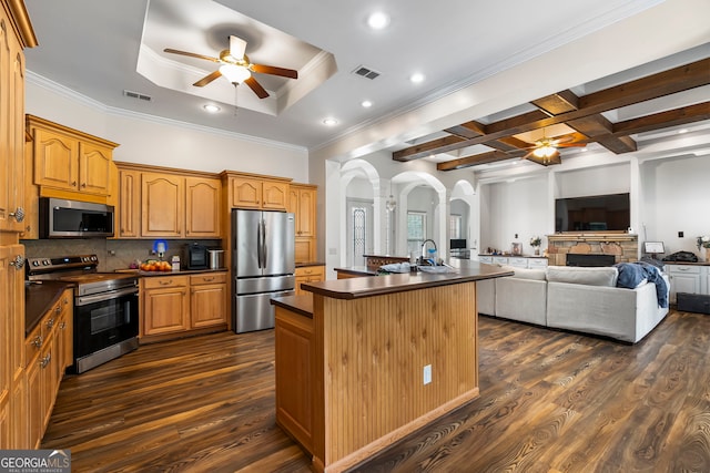 166 Freedom Ln, Commerce, GA 30530 - kitchen featuring stainless steel appliances, a ceiling fan, dark countertops, crown molding, and recessed lighting