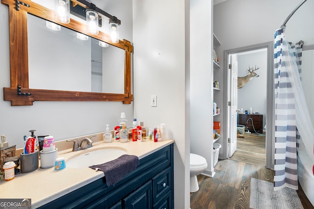 166 Freedom Ln, Commerce, GA 30530 - full bathroom featuring toilet, vanity, wood finished floors, and a shower with curtain
