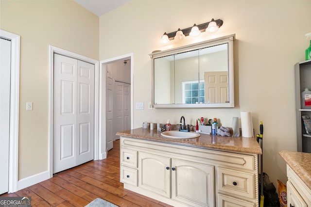 166 Freedom Ln, Commerce, GA 30530 - bathroom with hardwood / wood-style floors and vanity