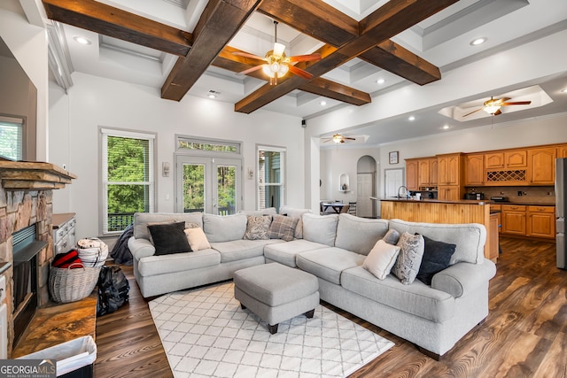 166 Freedom Ln, Commerce, GA 30530 - living room featuring ceiling fan, dark wood finished floors, a fireplace, beamed ceiling, and coffered ceiling
