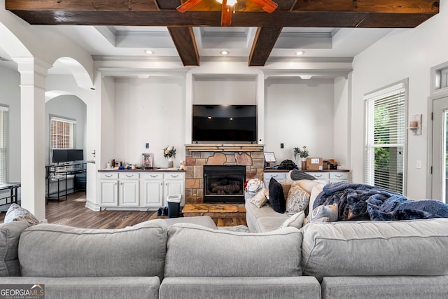 166 Freedom Ln, Commerce, GA 30530 - living room featuring wood finished floors, coffered ceiling, beamed ceiling, a fireplace, and ornate columns