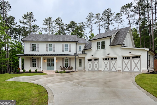 1050 Forrest Highlands, Greensboro, GA 30642 - modern inspired farmhouse with roof with shingles, concrete driveway, a standing seam roof, a porch, and board and batten siding