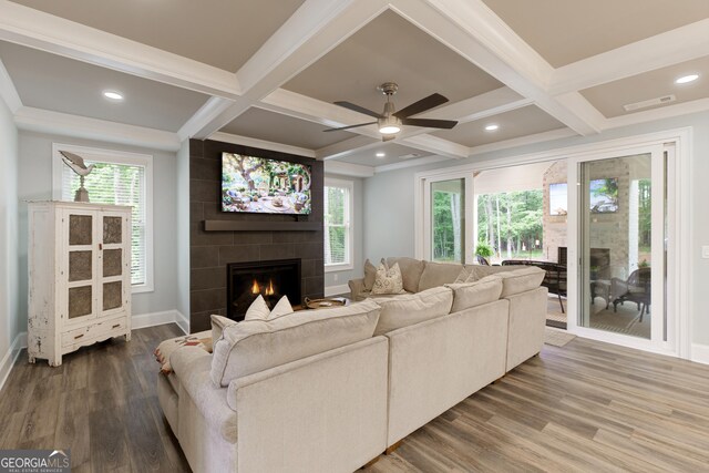 1050 Forrest Highlands, Greensboro, GA 30642 - living area featuring a fireplace, coffered ceiling, wood finished floors, healthy amount of natural light, and ceiling fan