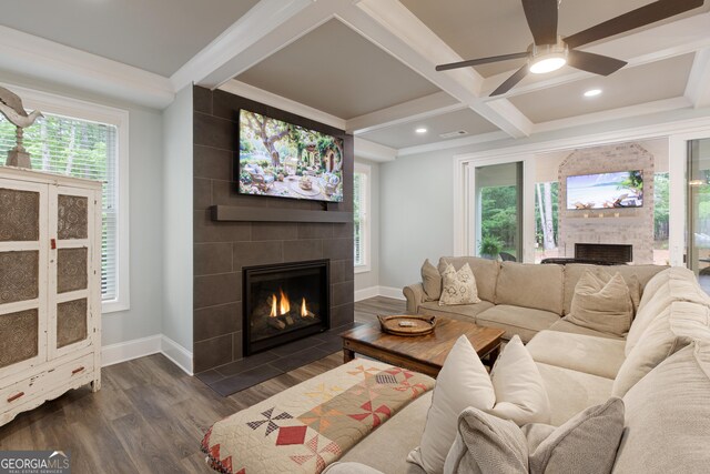 1050 Forrest Highlands, Greensboro, GA 30642 - living area featuring a tiled fireplace, baseboards, coffered ceiling, a ceiling fan, and plenty of natural light