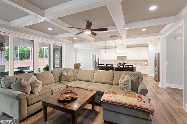 1050 Forrest Highlands, Greensboro, GA 30642 - living area with coffered ceiling, beam ceiling, light wood-style flooring, a ceiling fan, and recessed lighting