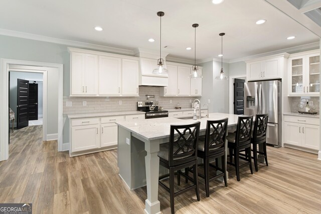 1050 Forrest Highlands, Greensboro, GA 30642 - kitchen featuring appliances with stainless steel finishes, a sink, ornamental molding, tasteful backsplash, and white cabinets