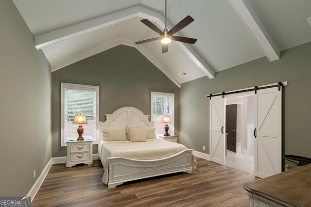 1050 Forrest Highlands, Greensboro, GA 30642 - bedroom featuring a barn door, dark wood finished floors, baseboards, and a ceiling fan