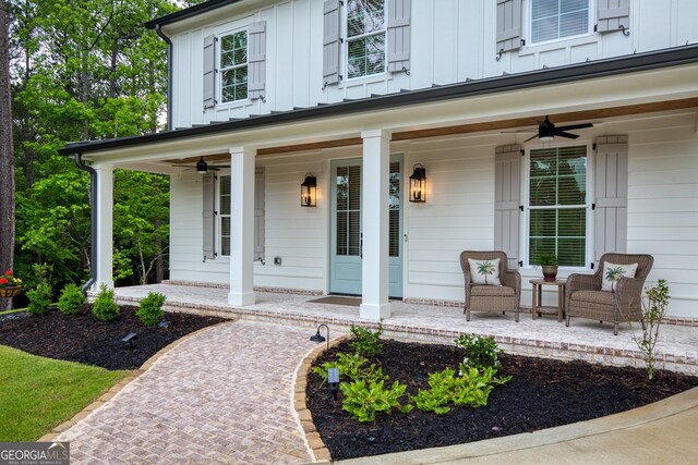 1050 Forrest Highlands, Greensboro, GA 30642 - view of exterior entry with covered porch, a ceiling fan, and board and batten siding