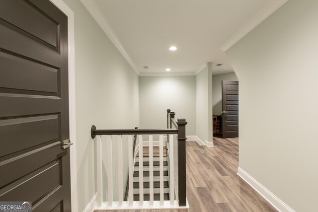 1050 Forrest Highlands, Greensboro, GA 30642 - corridor with an upstairs landing, crown molding, wood finished floors, baseboards, and recessed lighting