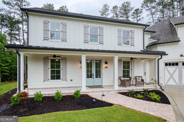 1050 Forrest Highlands, Greensboro, GA 30642 - modern farmhouse featuring a porch, board and batten siding, ceiling fan, and driveway