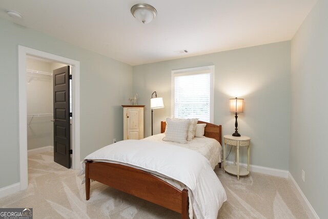 1050 Forrest Highlands, Greensboro, GA 30642 - bedroom with light carpet, a spacious closet, baseboards, and a closet