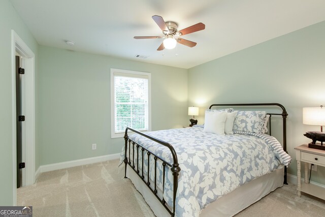 1050 Forrest Highlands, Greensboro, GA 30642 - bedroom featuring baseboards, light carpet, and ceiling fan