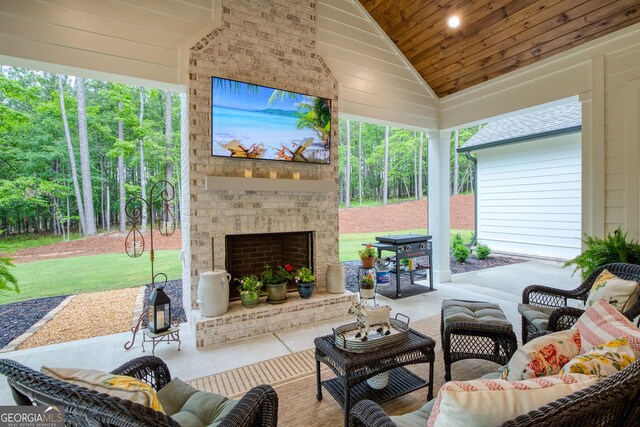 1050 Forrest Highlands, Greensboro, GA 30642 - sunroom featuring an outdoor living space with a fireplace and vaulted ceiling