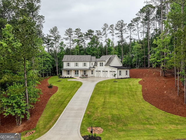 1050 Forrest Highlands, Greensboro, GA 30642 - rear view of property featuring concrete driveway, a lawn, and a garage