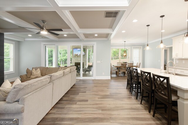 1050 Forrest Highlands, Greensboro, GA 30642 - living room featuring light wood-type flooring, plenty of natural light, a ceiling fan, baseboards, and recessed lighting